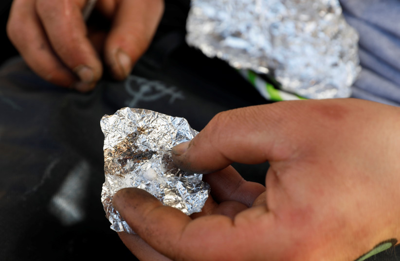 A man living on the streets displays what he says is the synthetic drug fentanyl in the Tenderloin section of San Francisco, California, US, February 27, 2020. (credit: REUTERS/SHANNON STAPLETON) A man living on the streets displays what he says is the synthetic drug fentanyl in the Tenderloin section of San Francisco, California, US, February 27, 2020. (credit: REUTERS/SHANNON STAPLETON)