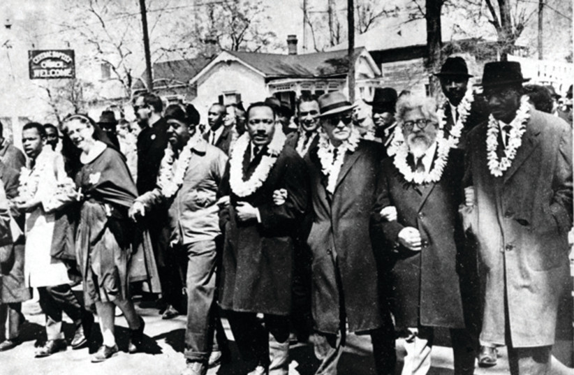 Rabbi Abraham Joshua Heschel (second from right) marching with Martin Luther King Jr. from Selma to Montgomery in 1965 (credit: WIKIPEDIA) Rabbi Abraham Joshua Heschel (second from right) marching with Martin Luther King Jr. from Selma to Montgomery in 1965 (credit: WIKIPEDIA)