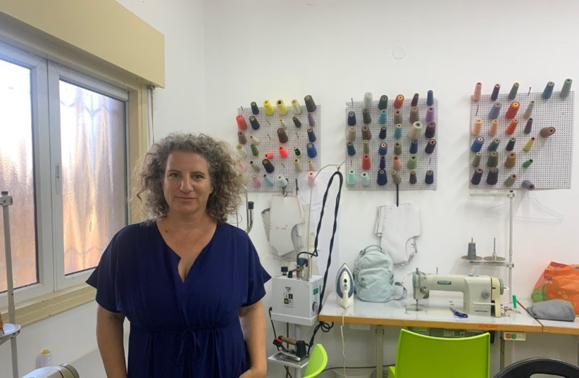TURNING THE TABLES founder Lilach Tzur Ben Moshe stands for a portrait in the Yotsrot Atid fashion studio in Tel Aviv, last month. (credit: ARIEL SHEINBERG) TURNING THE TABLES founder Lilach Tzur Ben Moshe stands for a portrait in the Yotsrot Atid fashion studio in Tel Aviv, last month. (credit: ARIEL SHEINBERG)