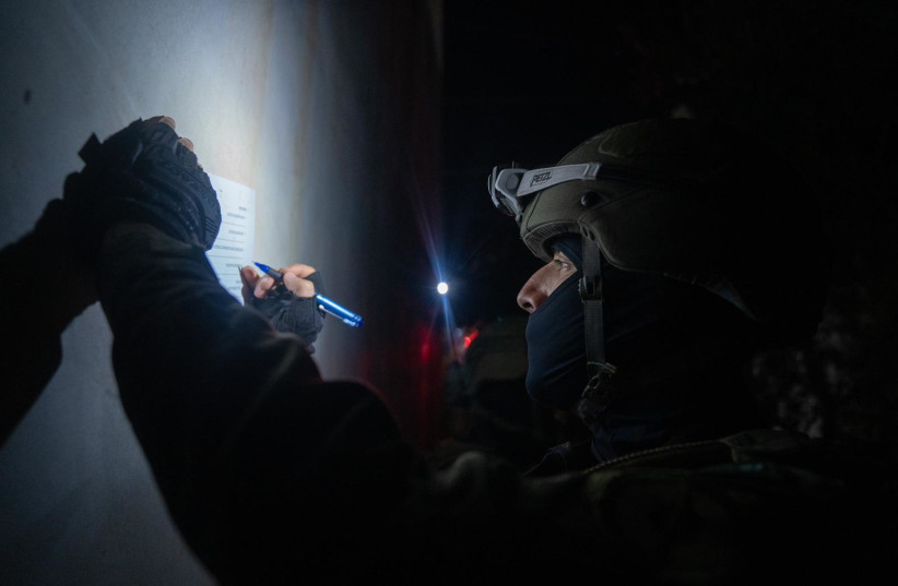 An IDF soldier is seen taking measurements for the eventual demolition of the home of the terrorist who shot and killed an Israeli municipal employee in Tel Aviv on August 5, 2023. (credit: IDF SPOKESPERSON'S UNIT) An IDF soldier is seen taking measurements for the eventual demolition of the home of the terrorist who shot and killed an Israeli municipal employee in Tel Aviv on August 5, 2023. (credit: IDF SPOKESPERSON'S UNIT)