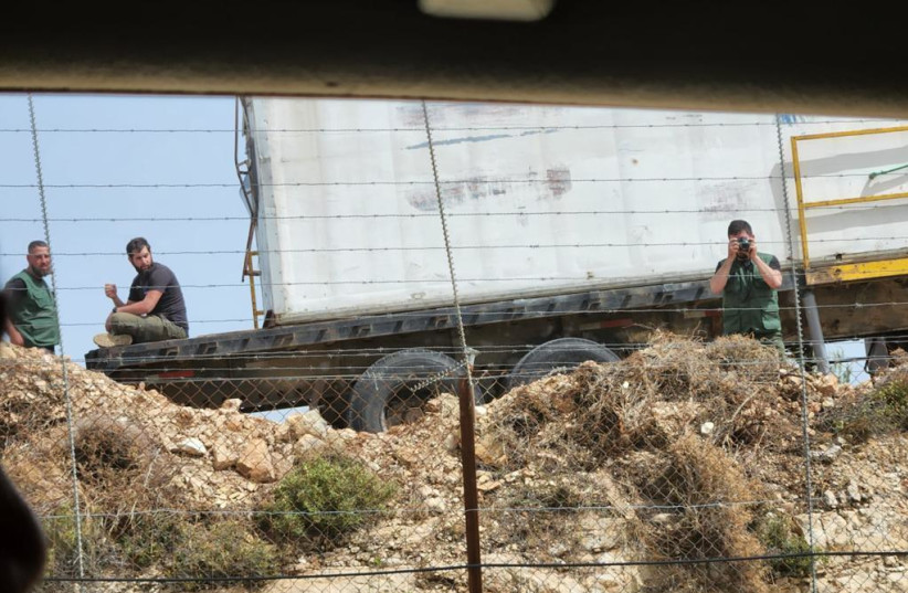 Alleged Hezbollah operatives at a Green Without Borders outpost the IDF says Hezbollah is using for reconnaissance (credit: IDF SPOKESPERSON'S UNIT) Alleged Hezbollah operatives at a Green Without Borders outpost the IDF says Hezbollah is using for reconnaissance (credit: IDF SPOKESPERSON'S UNIT)