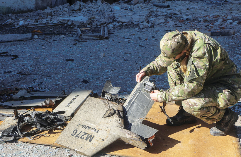 A UKRAINIAN police officer inspects parts of an Iranian-made Shahed-136 suicide drone at the site of a Russian strike on fuel storage facilities in Kharkiv in October 2022. (credit: REUTERS/VYACHESLAV MADIYEVSKYY) A UKRAINIAN police officer inspects parts of an Iranian-made Shahed-136 suicide drone at the site of a Russian strike on fuel storage facilities in Kharkiv in October 2022. (credit: REUTERS/VYACHESLAV MADIYEVSKYY)