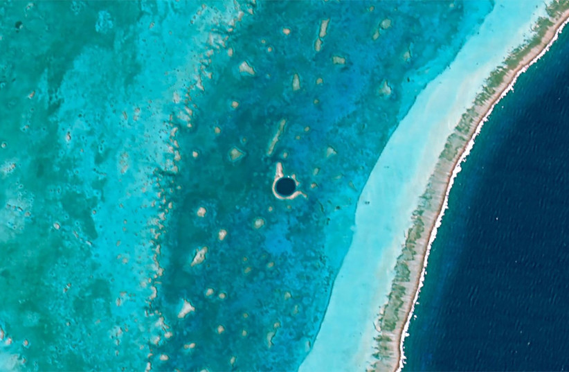 Satellite of Belize's Great Blue Hole. (credit: Wikimedia Commons) Satellite of Belize's Great Blue Hole. (credit: Wikimedia Commons)