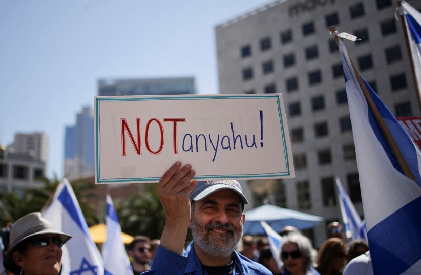 People gather to protest Israeli Prime Minister Benjamin Netanyahu's visit to California as he is scheduled to meet with entrepreneur Elon Musk, at Union Square in San Francisco, California, US. September 18, 2023. (credit: Carlos Barria/Reuters) People gather to protest Israeli Prime Minister Benjamin Netanyahu's visit to California as he is scheduled to meet with entrepreneur Elon Musk, at Union Square in San Francisco, California, US. September 18, 2023. (credit: Carlos Barria/Reuters)