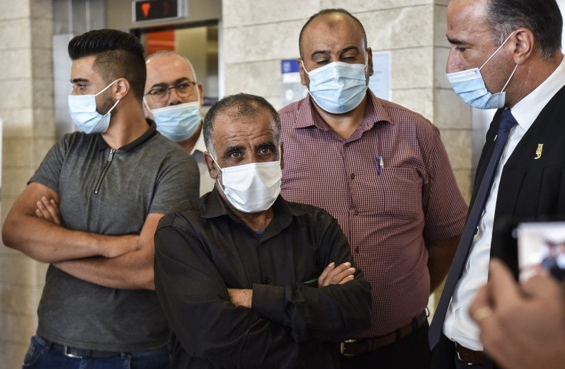 Hussein Dawabsha arrives for court hearing in Lod, to hear the verdict of Amiram Ben Uliel on his involvement in an arson attack in the West Bank village of Duma where three members of the Dawabshe family were killed, September 14, 2020. (credit: YOSSI ZELIGER/FLASH90) Hussein Dawabsha arrives for court hearing in Lod, to hear the verdict of Amiram Ben Uliel on his involvement in an arson attack in the West Bank village of Duma where three members of the Dawabshe family were killed, September 14, 2020. (credit: YOSSI ZELIGER/FLASH90)