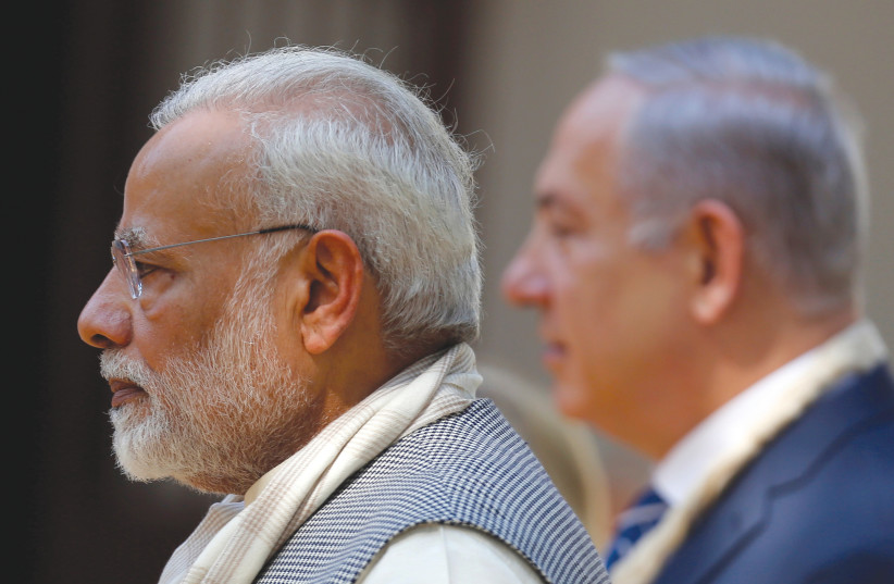 INDIA’S PRIME MINISTER Narendra Modi and his then-Israeli counterpart Benjamin Netanyahu walk during their visit to Gandhi Ashram in Ahmedabad, India, in 2018. It was only with the rise of Modi in 2014 that the relationship became distinctly declared and public. (credit: REUTERS/AMIT DAVE) INDIA’S PRIME MINISTER Narendra Modi and his then-Israeli counterpart Benjamin Netanyahu walk during their visit to Gandhi Ashram in Ahmedabad, India, in 2018. It was only with the rise of Modi in 2014 that the relationship became distinctly declared and public. (credit: REUTERS/AMIT DAVE)