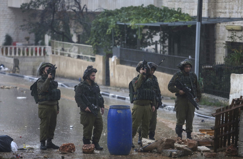 Palestinian stone throwers clash with Israeli soldiers at Al-Biereh town neighboring the Israeli settlement of Psagot, near Ramallah, West Bank, November 6, 2015. (credit: FLASH90) Palestinian stone throwers clash with Israeli soldiers at Al-Biereh town neighboring the Israeli settlement of Psagot, near Ramallah, West Bank, November 6, 2015. (credit: FLASH90)