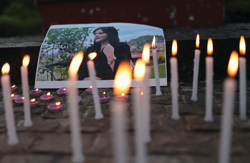 A PHOTO OF Mahsa Amini is pictured at a vigil of students and activists from Delhi University in New Delhi, India, last September following her death. (credit: REUTERS/ANUSHREE FADNAVIS) A PHOTO OF Mahsa Amini is pictured at a vigil of students and activists from Delhi University in New Delhi, India, last September following her death. (credit: REUTERS/ANUSHREE FADNAVIS)