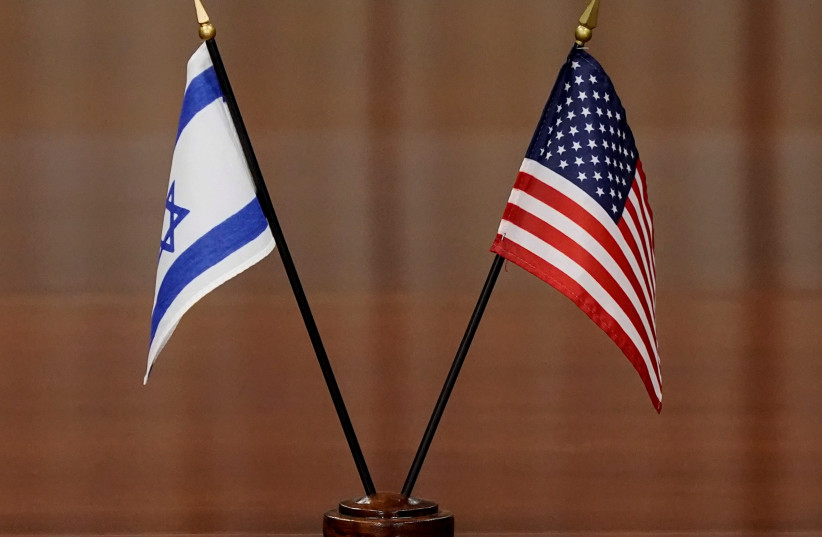 The flags of Israel and the US are seen at a table during a meeting between officials from the two countries. (credit: REUTERS/KEN CEDENO) The flags of Israel and the US are seen at a table during a meeting between officials from the two countries. (credit: REUTERS/KEN CEDENO)