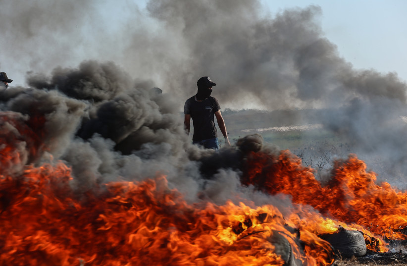 Palestinian protesters gather during a demonstration along the border fence with Israel, east of Gaza City, on September 18, 2023. (credit: ATIA MOHAMMED/FLASH90) Palestinian protesters gather during a demonstration along the border fence with Israel, east of Gaza City, on September 18, 2023. (credit: ATIA MOHAMMED/FLASH90)