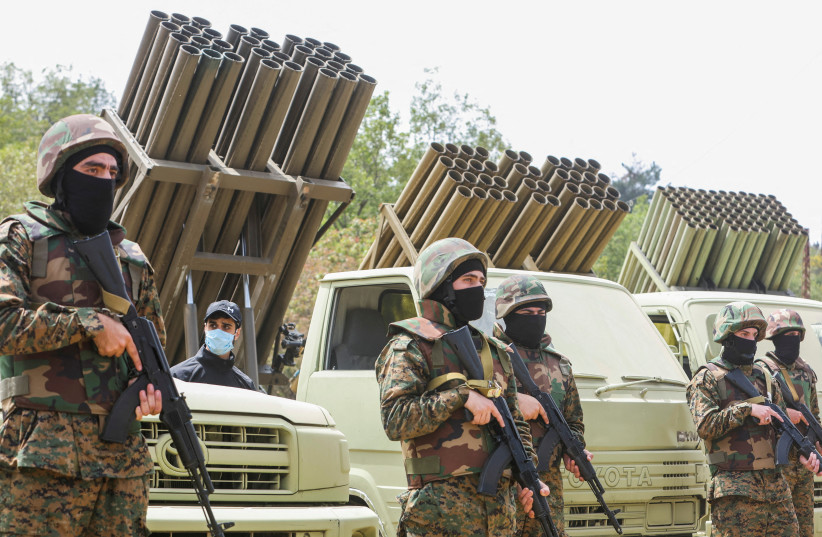 Hezbollah members take part in a military exercise during a media tour organized for the occasion of Resistance and Liberation Day, in Aaramta, Lebanon May 21, 2023. (credit: AZIZ TAHER/REUTERS) Hezbollah members take part in a military exercise during a media tour organized for the occasion of Resistance and Liberation Day, in Aaramta, Lebanon May 21, 2023. (credit: AZIZ TAHER/REUTERS)