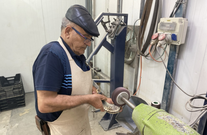 Shimon Keinan sanding a shofar in his workshop at Kol Shofar, Moshav Ramat Yoav, Israel. (credit: Aaron Poris/The Media Line) Shimon Keinan sanding a shofar in his workshop at Kol Shofar, Moshav Ramat Yoav, Israel. (credit: Aaron Poris/The Media Line)
