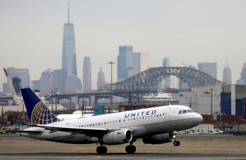 A United Airlines passenger jet takes off with New York City as a backdrop, at Newark Liberty International Airport, New Jersey, US December 6, 2019. (credit: REUTERS/CHRIS HELGREN) A United Airlines passenger jet takes off with New York City as a backdrop, at Newark Liberty International Airport, New Jersey, US December 6, 2019. (credit: REUTERS/CHRIS HELGREN)