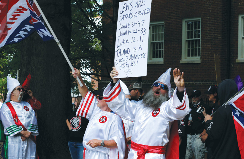 MEMBERS OF the Ku Klux Klan rally in Charlottesville, Virginia, in 2017. Antisemitism is a growing and worrisome problem in the United States, the writer asserts. (credit: JONATHAN ERNST/REUTERS) MEMBERS OF the Ku Klux Klan rally in Charlottesville, Virginia, in 2017. Antisemitism is a growing and worrisome problem in the United States, the writer asserts. (credit: JONATHAN ERNST/REUTERS)