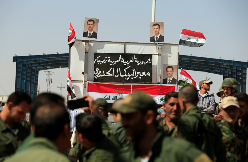 Security forces are seen at the Iraqi-Syrian border crossing, after it has been reopened for trade and travel, in Al Qaim, Iraq September 30, 2019 (credit: REUTERS/THAIER AL-SUDANI) Security forces are seen at the Iraqi-Syrian border crossing, after it has been reopened for trade and travel, in Al Qaim, Iraq September 30, 2019 (credit: REUTERS/THAIER AL-SUDANI)
