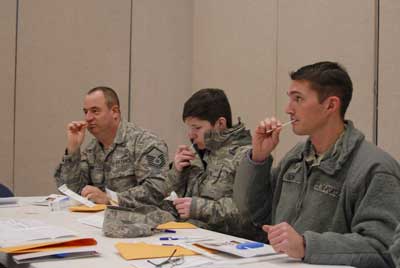 Airmen from the 180th Fighter Wing swab the inside of their cheek for the registration process during the wing's two-day bone marrow registration drive in 2015. Part of the Salute to Life Program, it works with active duty and their dependents, Guard, reservists, and Department of Defense civilian employees to facilitate marrow and stem cell donations. Photo by Senior Master Sgt. Beth Holliker, courtesy of the Air National Guard.