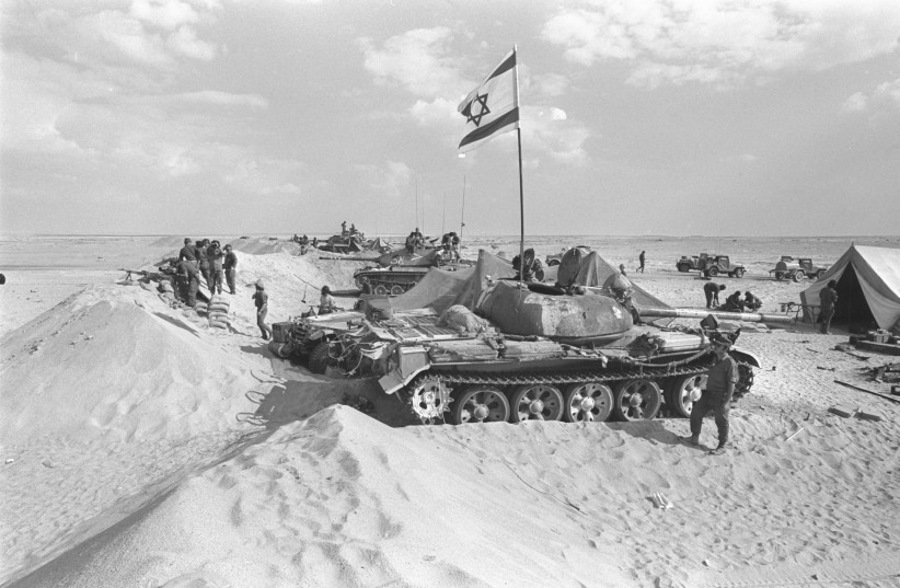 An IDF armored unit in its encampment on the east bank of the Suez Canal during the 1973 Yom Kippur War. (credit: YIGAL TOMARKIN/GPO) An IDF armored unit in its encampment on the east bank of the Suez Canal during the 1973 Yom Kippur War. (credit: YIGAL TOMARKIN/GPO)