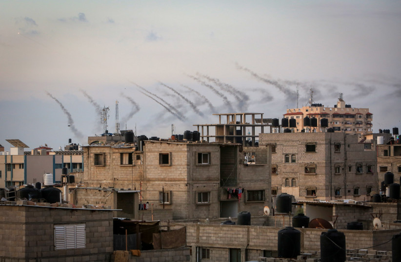 Hamas fires a large number of rockets towards Israel in the city of Rafah in the southern Gaza Strip, October 7, 2023 (credit: ABED RAHIM KHATIB/FLASH90) Hamas fires a large number of rockets towards Israel in the city of Rafah in the southern Gaza Strip, October 7, 2023 (credit: ABED RAHIM KHATIB/FLASH90)