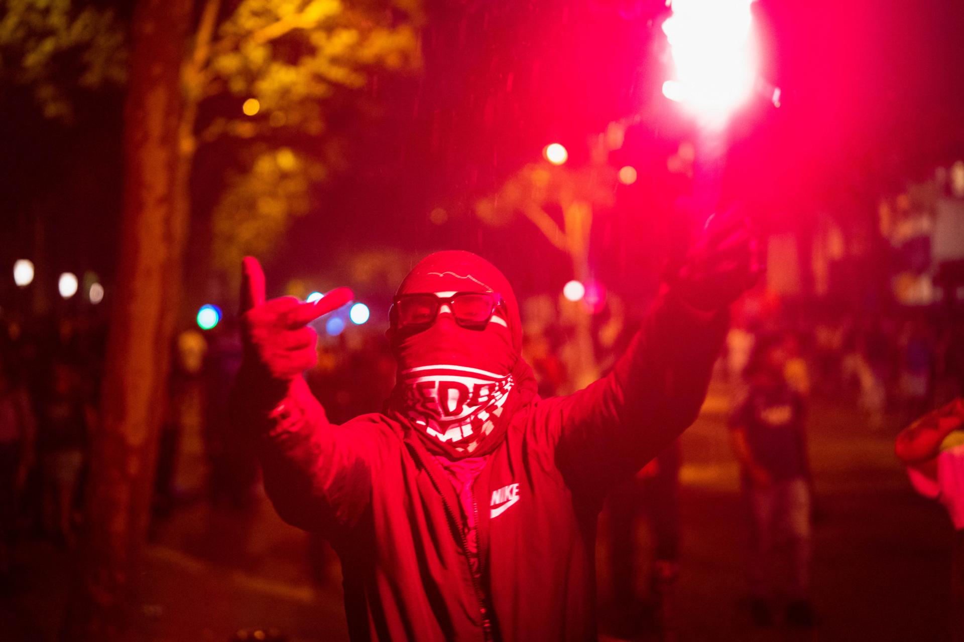 Paris Saint-Germain (PSG) supporters gather holding flares in Paris early June 1, 2025, during celebrations following their 5-0 victory in the UEFA Champions League final football match against Inter Milan held in Munich. (Photo by Nael Chahine / Middle East Images / Middle East Images via AFP) (Photo by NAEL CHAHINE/Middle East Images/AFP via Getty Images)