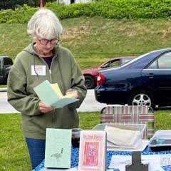 Sue Blaustein sells her poetry books at a book fair in 2023 . (Photo courtesy of Sue Blaustein)