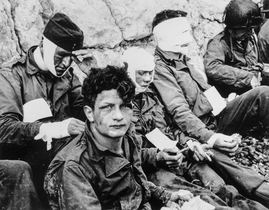 A group of American assault troops who, although wounded, stormed the beachhead and gained the comparative safety of the chalk cliffs at their backs.