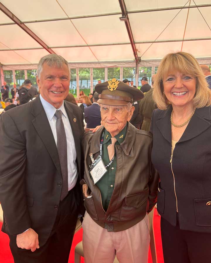 The author and his wife, retired Maj. Gen. Maggie Woodward, met WWII veterans at the D-Day 80th anniversary commemoration.